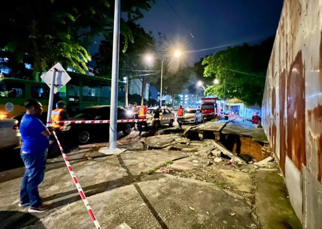 Lubang besar di tepi jalan Kg Kerinchi selepas longkang runtuh, kawasan  dikawal oleh DBKL