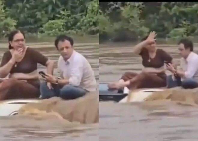 Suami isteri  terperangkap atas bumbung kereta dalam banjir